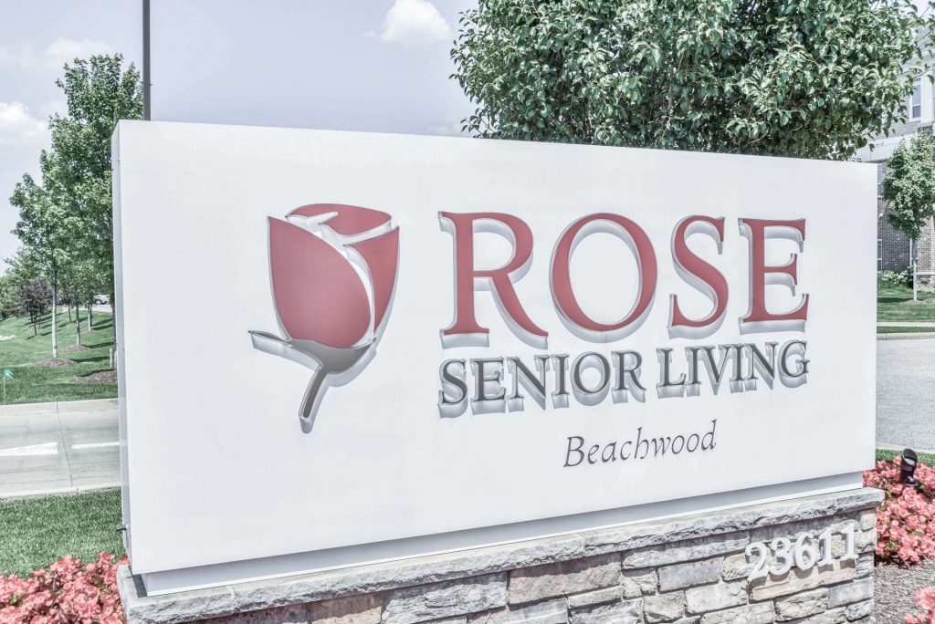 Sign for Rose Senior Living Beachwood, featuring a red rose graphic