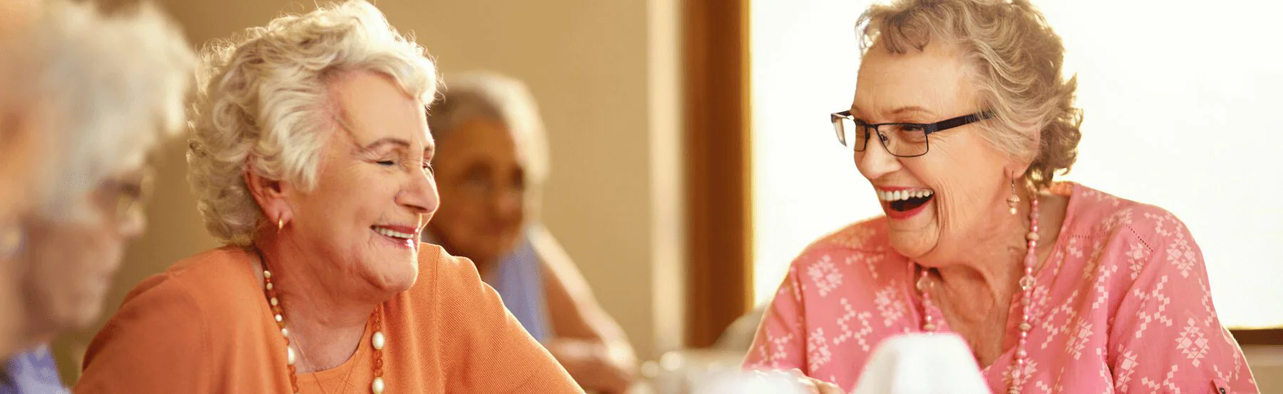 senior women laughing together