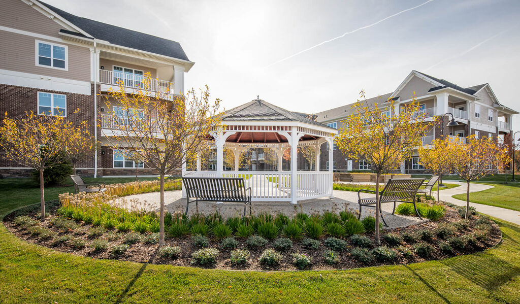 Outdoor gazebo on senior living community campus walking path
