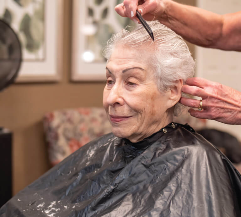 Senior woman at the hair salon, getting her hair done